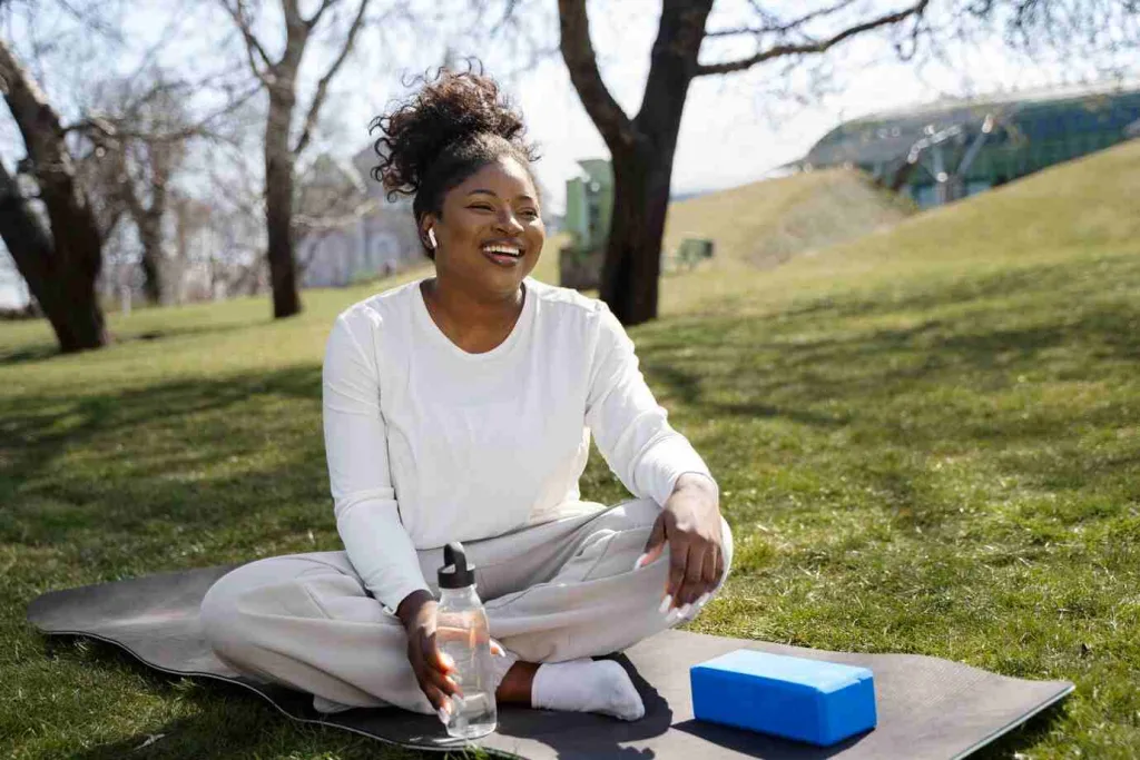 full shot smiley woman yoga mat 23 2149409901